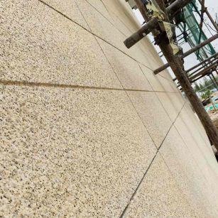 鸡西 黄金麻花岗岩荔枝面外墙干挂石材效果示例